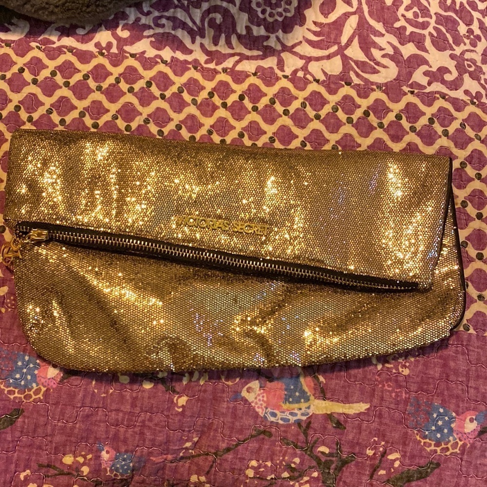 Victoria’s Secret gold metallic clutch. VS105